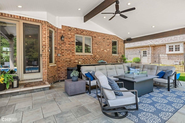 view of patio featuring an outdoor living space, fence, and a ceiling fan