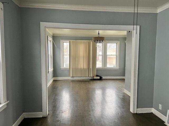 5515 S Hoyne Ave, Chicago, IL 60636 - empty room featuring dark wood finished floors, baseboards, and ornamental molding