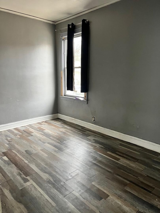 5515 S Hoyne Ave, Chicago, IL 60636 - empty room with crown molding, baseboards, and wood finished floors