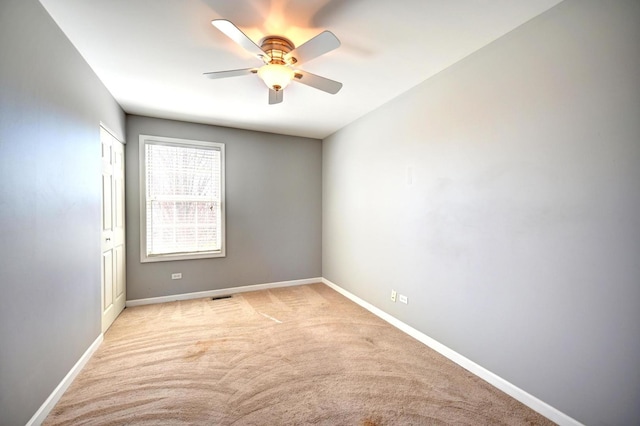 9208 Dexter Ct, Orland Park, IL 60462 - spare room featuring light colored carpet, baseboards, and ceiling fan