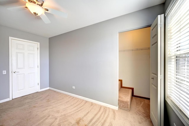 9208 Dexter Ct, Orland Park, IL 60462 - unfurnished bedroom with a closet, multiple windows, and light colored carpet