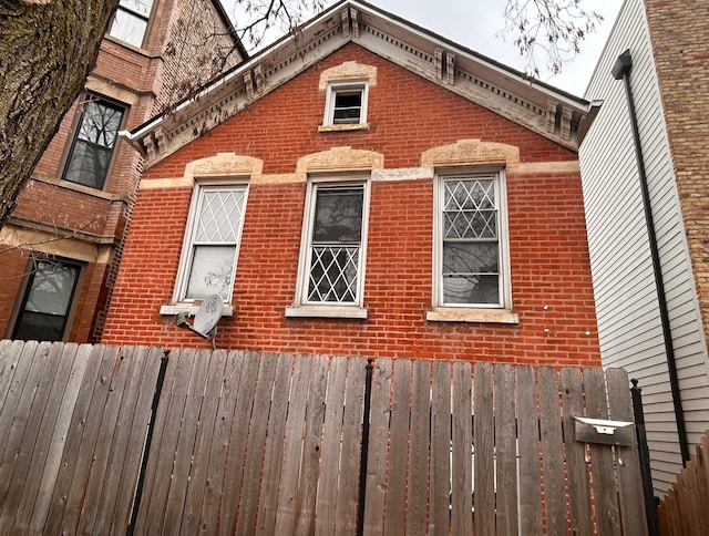 1744 W 17th St, Chicago, IL 60608 - view of property exterior featuring brick siding and fence