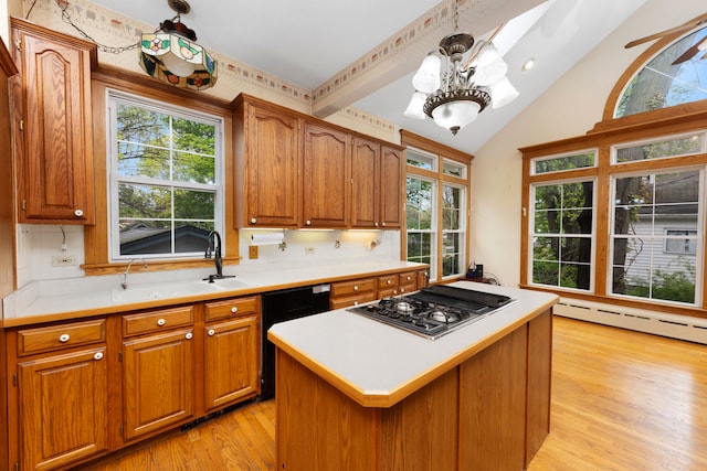 203 High St, West Chicago, IL 60185 - kitchen featuring stainless steel gas stovetop, black dishwasher, tasteful backsplash, light countertops, and vaulted ceiling
