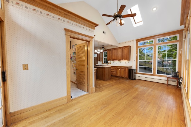 203 High St, West Chicago, IL 60185 - kitchen with a skylight, a baseboard radiator, light wood-style floors, a chandelier, and brown cabinets