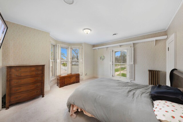 203 High St, West Chicago, IL 60185 - bedroom with wallpapered walls, crown molding, multiple windows, radiator heating unit, and light carpet