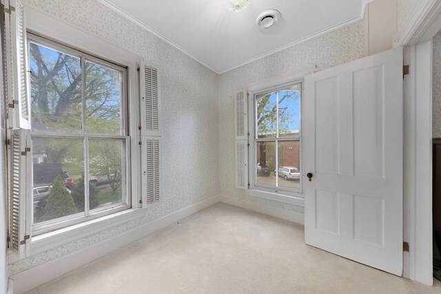 203 High St, West Chicago, IL 60185 - empty room featuring wallpapered walls, light carpet, crown molding, healthy amount of natural light, and baseboards
