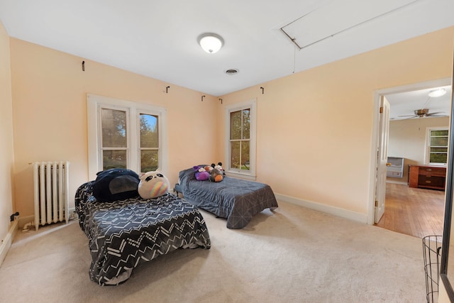 203 High St, West Chicago, IL 60185 - carpeted bedroom with radiator, attic access, and baseboards