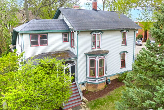 203 High St, West Chicago, IL 60185 - victorian house featuring a chimney and roof with shingles