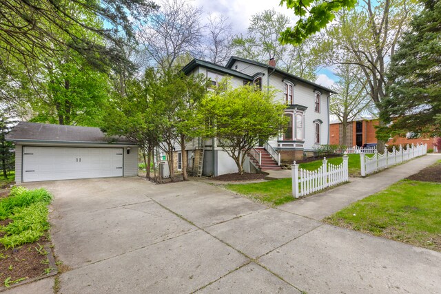 203 High St, West Chicago, IL 60185 - view of front of house featuring a chimney and a fenced front yard