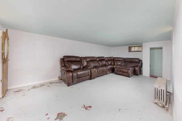 203 High St, West Chicago, IL 60185 - living room featuring concrete floors, radiator, and baseboards