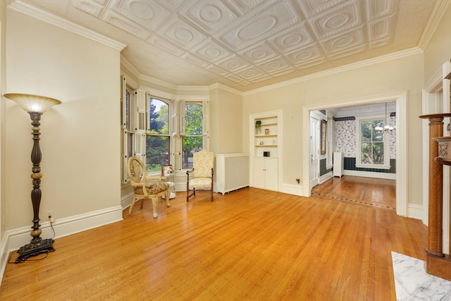 203 High St, West Chicago, IL 60185 - living area with radiator, light wood-style floors, built in features, an ornate ceiling, and baseboards