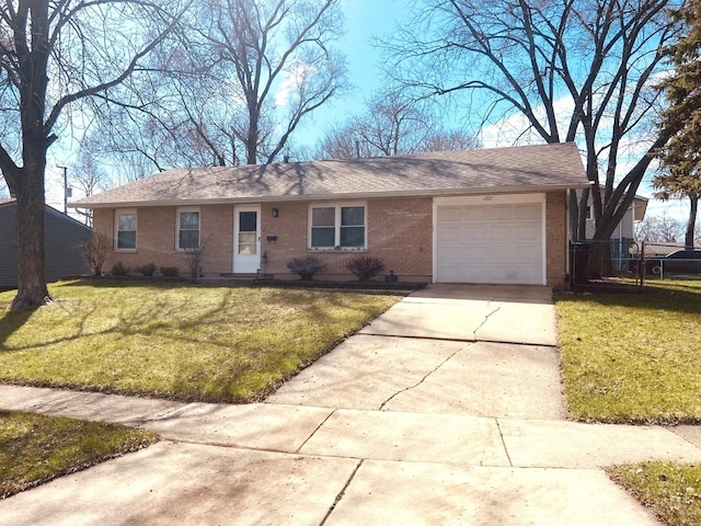 single story home with a shingled roof, a garage, concrete driveway, brick siding, and a front lawn