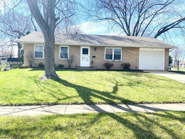 ranch-style house with concrete driveway, a front yard, brick siding, and an attached garage