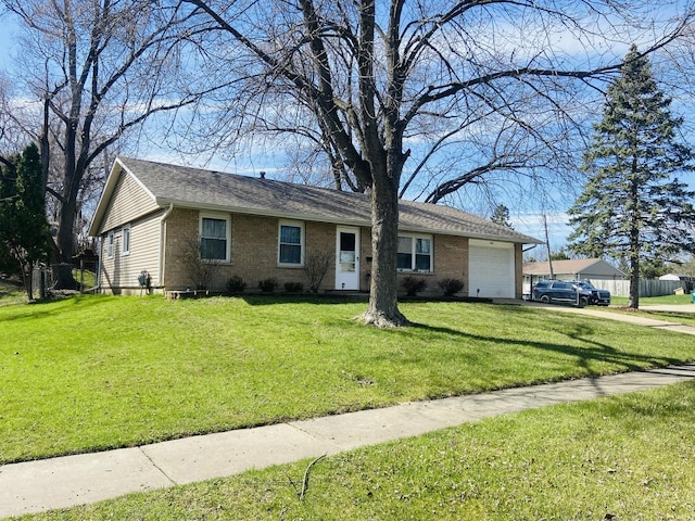 ranch-style home with brick siding, a front yard, an attached garage, and driveway