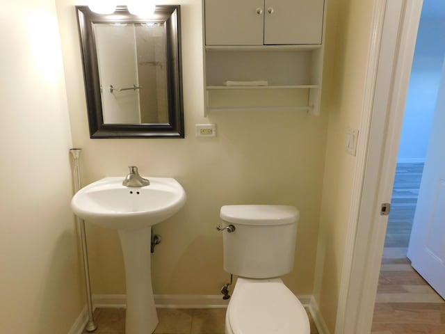 5300 N Lincoln Ave Unit 5A, Chicago, IL 60625 - half bathroom featuring baseboards and toilet
