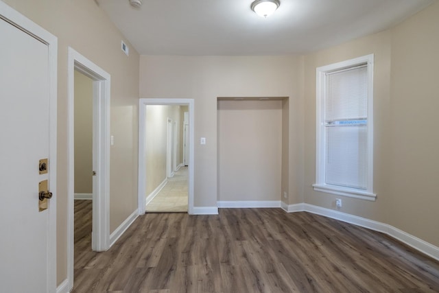 6609 S Rhodes Ave, Chicago, IL 60637 - unfurnished bedroom with visible vents, baseboards, and wood finished floors