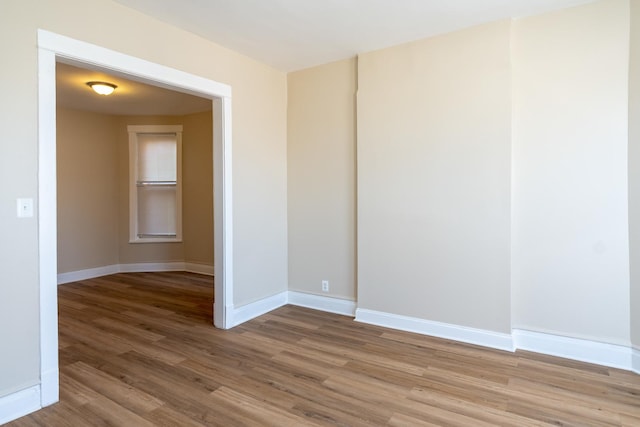 6609 S Rhodes Ave, Chicago, IL 60637 - empty room with wood finished floors and baseboards