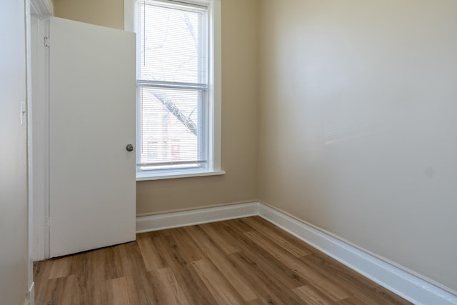 6609 S Rhodes Ave, Chicago, IL 60637 - empty room with baseboards and wood finished floors