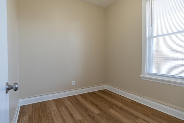6609 S Rhodes Ave, Chicago, IL 60637 - spare room with wood finished floors and baseboards