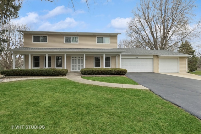 traditional home with a front lawn, aphalt driveway, a porch, a garage, and a shingled roof