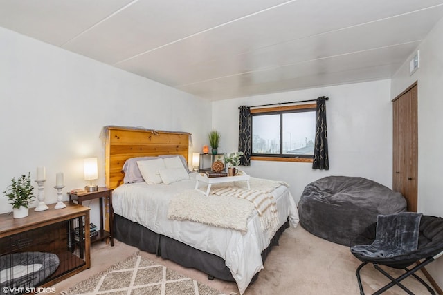 bedroom featuring carpet flooring and visible vents