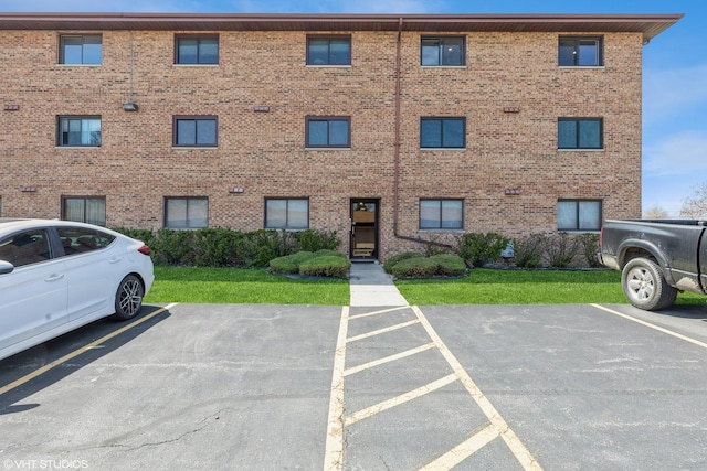 view of property with uncovered parking