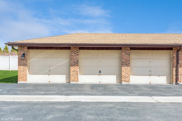 garage with fence