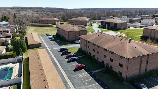 bird's eye view with a residential view and a wooded view