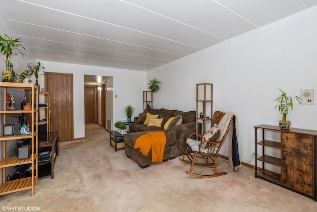 carpeted living area featuring visible vents