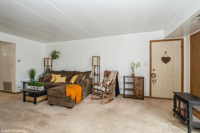 living area featuring carpet floors and visible vents