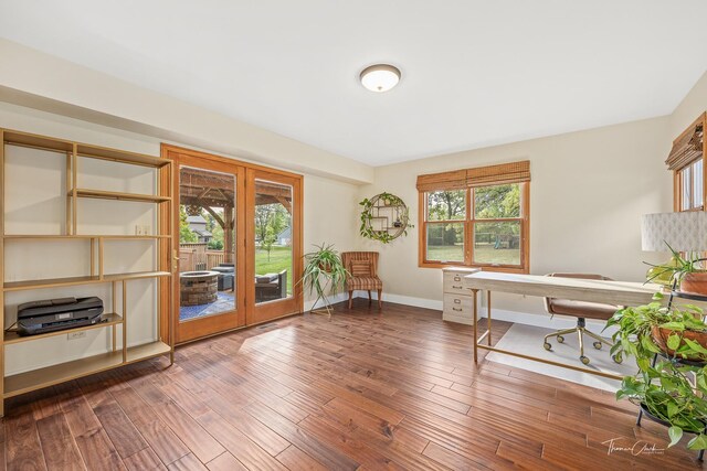 office featuring french doors, baseboards, and wood finished floors