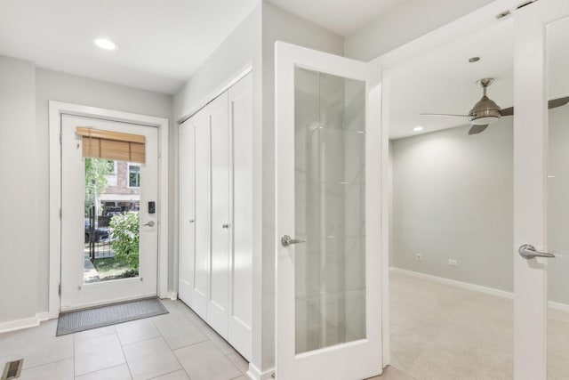 entryway with light tile patterned floors, baseboards, a ceiling fan, and recessed lighting
