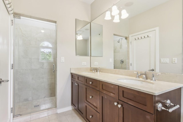 bathroom with tile patterned floors, double vanity, a sink, and a stall shower
