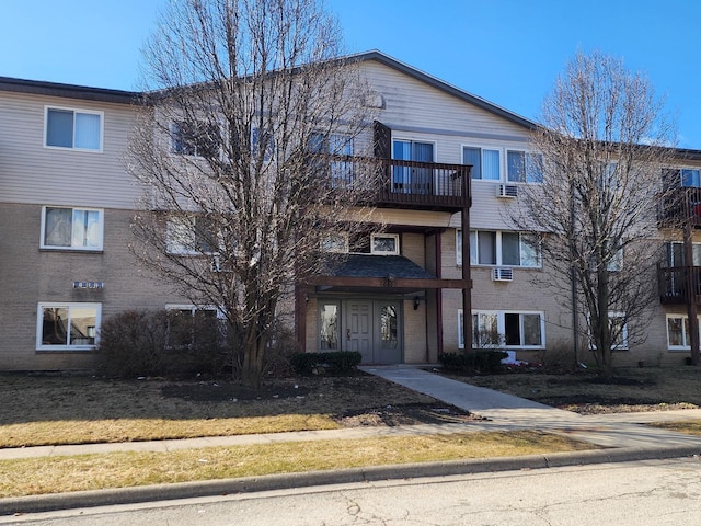 655 Deepwoods Dr Unit 1F, Mundelein, IL 60060 - view of front of house featuring an AC wall unit