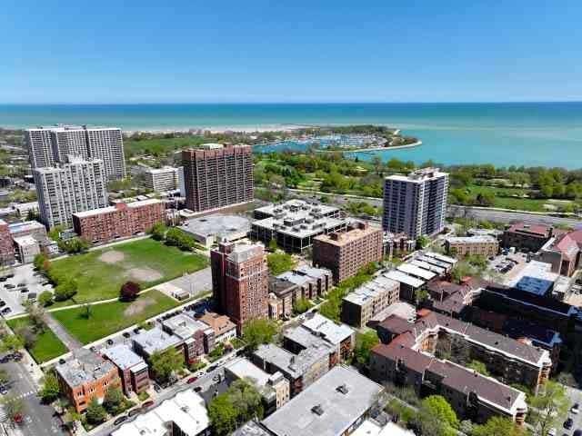 view of urban area with a large body of water