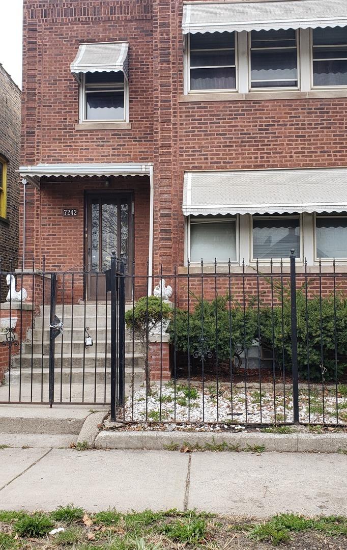 7242 S E End Ave, Chicago, IL 60649 - view of exterior entry featuring brick siding and fence