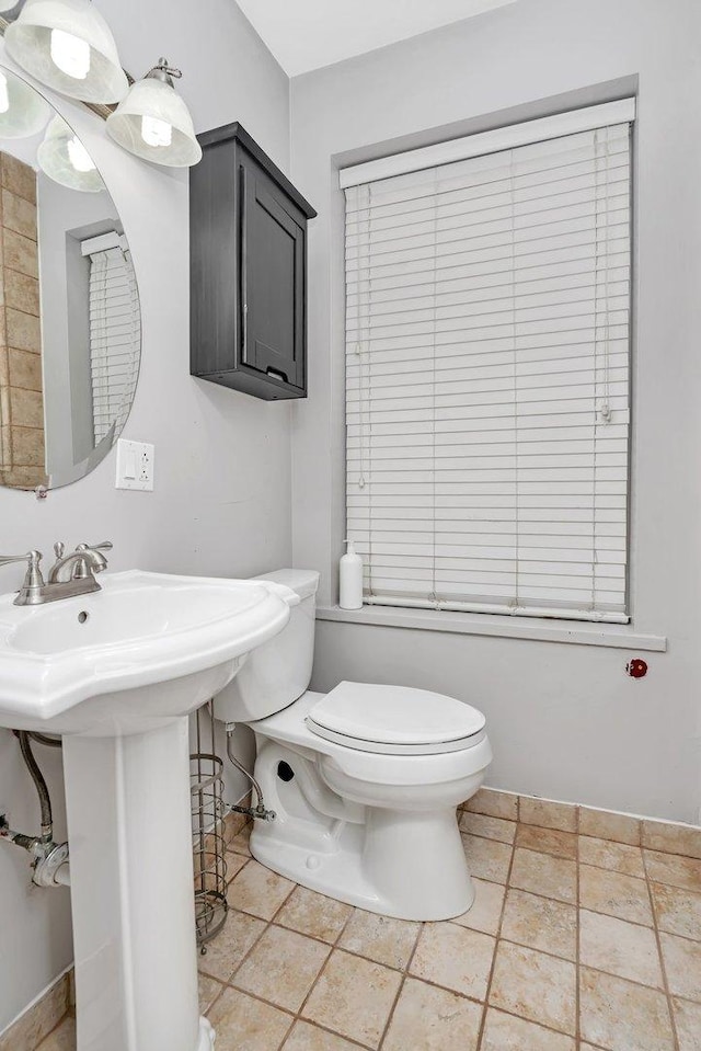 half bath featuring toilet