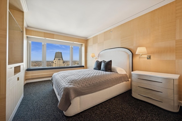 bedroom with crown molding and dark colored carpet