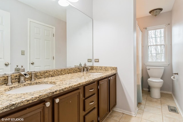 1164 Lakewood Cir, Naperville, IL 60540 - full bath with tile patterned flooring, toilet, double vanity, and baseboards