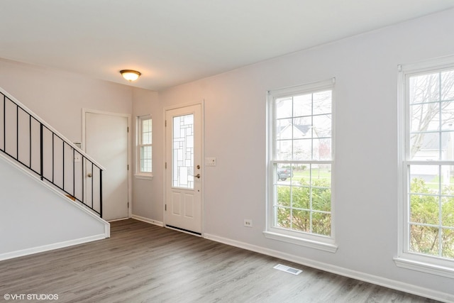 1164 Lakewood Cir, Naperville, IL 60540 - foyer with wood finished floors, stairway, plenty of natural light, and baseboards