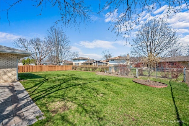 view of yard featuring a fenced backyard