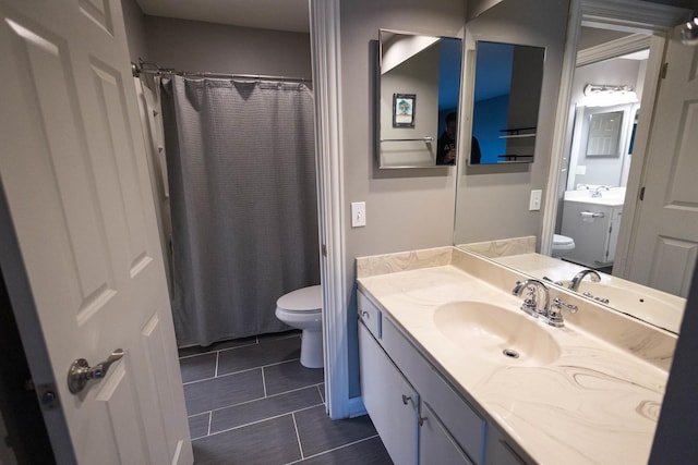 9132 Clairmont Ct Unit 113, Orland Park, IL 60462 - full bathroom featuring a shower with shower curtain, vanity, and toilet