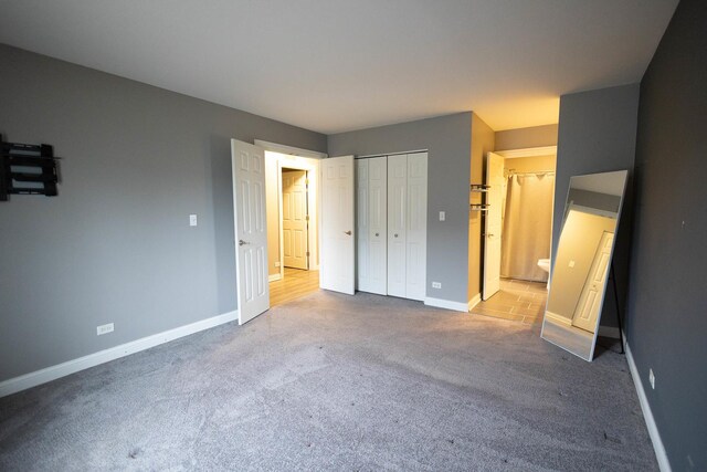 9132 Clairmont Ct Unit 113, Orland Park, IL 60462 - unfurnished bedroom featuring a closet, carpet flooring, baseboards, and connected bathroom