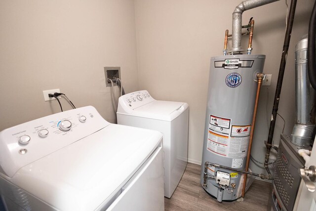 9132 Clairmont Ct Unit 113, Orland Park, IL 60462 - laundry room with washer and clothes dryer, light wood finished floors, laundry area, and gas water heater