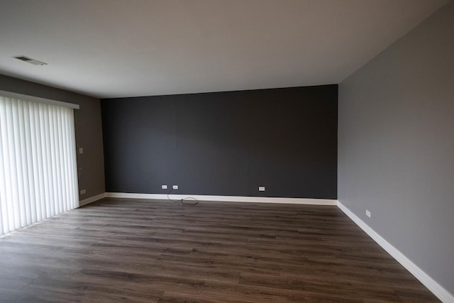 9132 Clairmont Ct Unit 113, Orland Park, IL 60462 - empty room with baseboards, dark wood finished floors, and visible vents