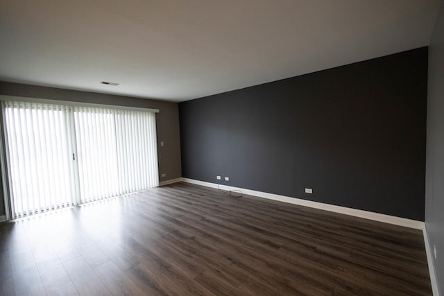 9132 Clairmont Ct Unit 113, Orland Park, IL 60462 - empty room featuring dark wood-type flooring, baseboards, visible vents, and a wealth of natural light