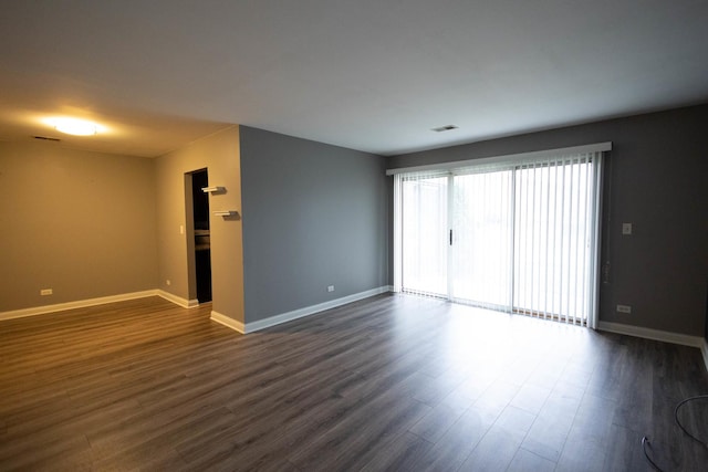 9132 Clairmont Ct Unit 113, Orland Park, IL 60462 - empty room featuring dark wood-style flooring, baseboards, and visible vents