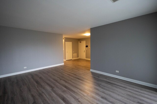 9132 Clairmont Ct Unit 113, Orland Park, IL 60462 - spare room with dark wood-style floors, baseboards, and visible vents