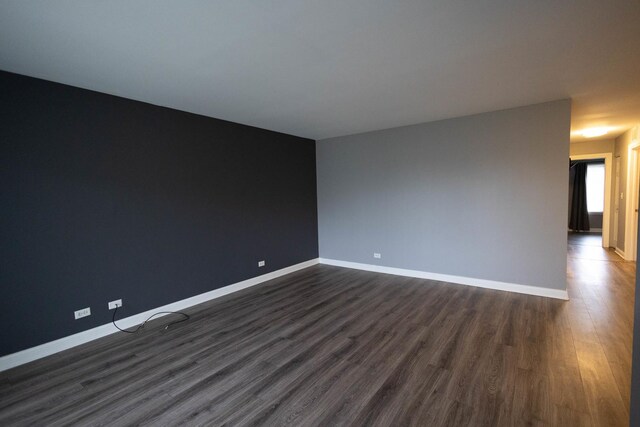 9132 Clairmont Ct Unit 113, Orland Park, IL 60462 - spare room featuring dark wood-type flooring and baseboards