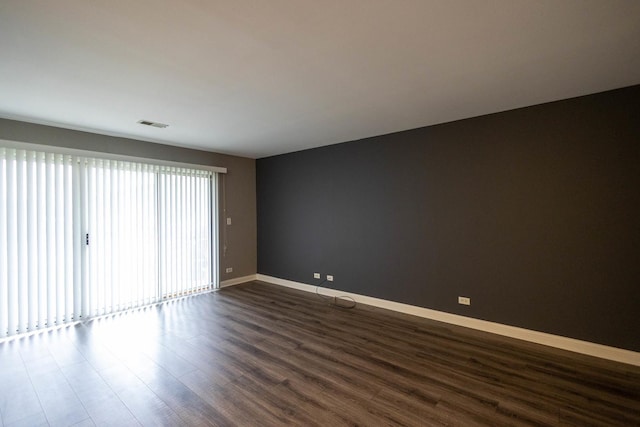 9132 Clairmont Ct Unit 113, Orland Park, IL 60462 - unfurnished room featuring dark wood-type flooring, visible vents, and baseboards
